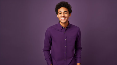 Happy man in purple shirt on deep purple for copy spaceの素材