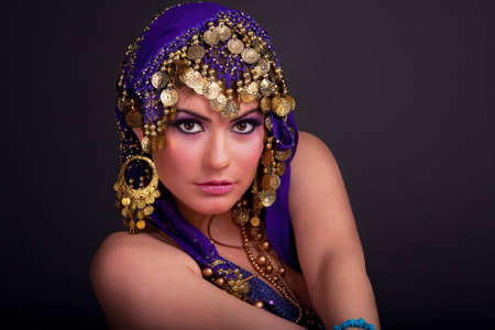 Beautiful girl in a stylized ethnic costume and shawlの写真素材
