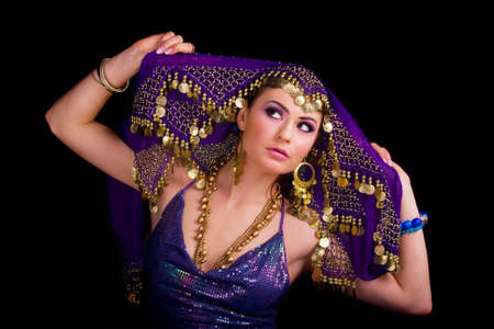Beautiful girl in a stylized ethnic costume and shawlの写真素材