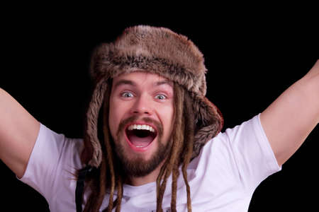 Guy with dreadlocks wearing a fur hatの写真素材