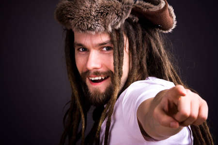 Guy with dreadlocks wearing a fur hatの写真素材