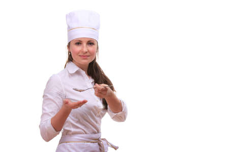 Beautiful young woman cooking isolated white backgroundの写真素材