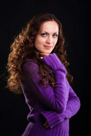 Beautiful smiling woman with colored warm sweaterの写真素材