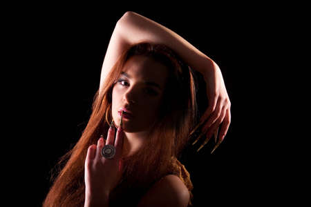 Beautiful young longhair brunette in a romantic poseの写真素材