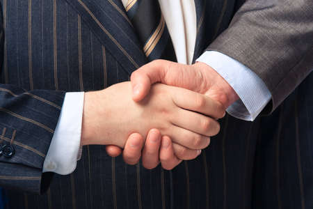 Handshake isolated on business backgroundの写真素材