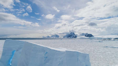 Aerial Flight Over Antarctica Iceberg, Ocean. White Landscape. Amazing Drone Shot Of Ice Frozen...