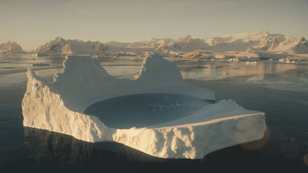 Iceberg pool. Antarctica aerial view drone flight. Slow motion flying over the large iceberg with...