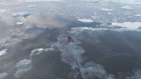 Zodiac Boat Sail Brash Ice Water Back Aerial View. Expedition Rubber Transport Explore Extreme...