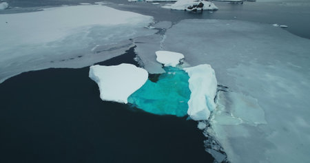 Antarctica melting blue water iceberg. Antarctic ocean environment. Arctic Ice. Serene beauty of...