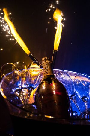 AMSTERDAM, THE NETHERLANDS, JULY 27 2018 - Bottle of Moant Champage served in a bucket with fireworks and luxurious glasses in the Netherlandsのeditorial素材