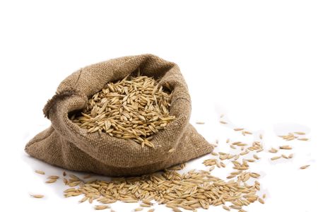 Sack with oat.Isolated on whiteの写真素材