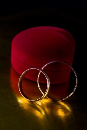 Two wedding rings on a black background