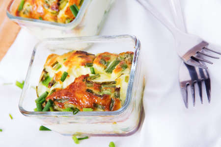 Omelet baked in the oven. food background. Scrambled eggs with green onions. Table served with...