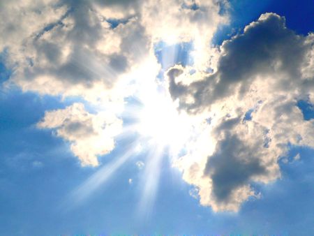sunshine behind the clouds の写真素材