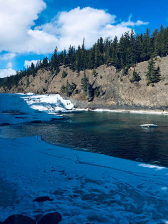 Scenic view of Bow falls and the spectacular surrounding landscapeの写真素材