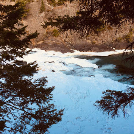Scenic view of Bow falls and the spectacular surrounding landscapeの写真素材