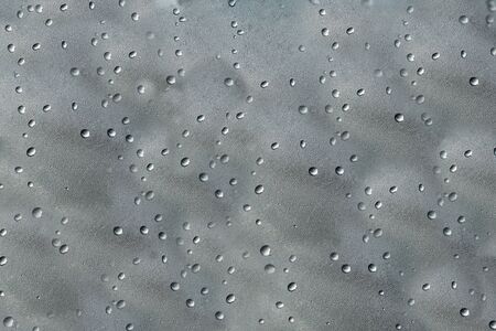 close up of dew droplets on glass.patterns  and texture of dew drops on glass.