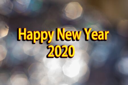 happy new year 2020 with bokeh background.yellow color text with black shade.