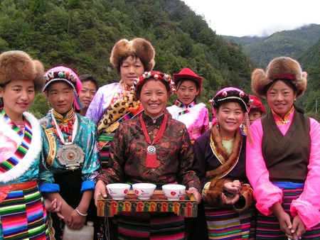 Near Danba, Sichuan, China - 21 August 2005. Girls welcoming travellers to a local monasteryのeditorial素材