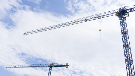Crane / Cranes on Blue Sky With Clouds for Construction Advertising Designの写真素材