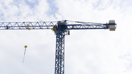 Crane / Cranes on Blue Sky With Clouds for Construction Advertising Designの写真素材