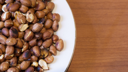 Roasted Peanuts Snack in White Plate in Wooden Backgrounds - Ð¢opview ans Closeup