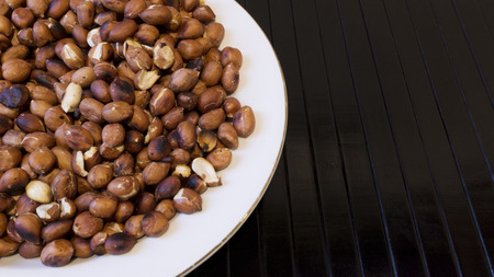 Roasted Peanuts Snack in White Plate in Wooden Backgrounds - Ð¢opview ans Closeup
