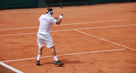 Tennis player enjoying the win of the game.