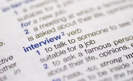 Close-up of the definition of the dictionary word interview