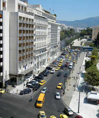 Athens; Greece - August 28: Cityscape of Athens with cars and yellow taxis near Syntagma square on August 28, 2014  in Athens  Greece.のeditorial素材