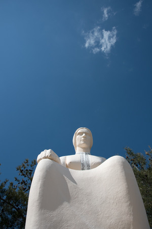 Famous landmark monument statue of the Cypriot mother or  mana  statue at  Palaichori village in Cyprus. The statue is situated at a hill above the village of Palaichori at Troodos mountain area.の写真素材