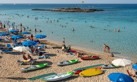PROTARAS,  CYPRUS -  JULY  14: Tourists at Fig Tree famous bay beach relaxing and  enjoying their summer holidays on July 14, 2015 at Protaras area in  Cyprusのeditorial素材