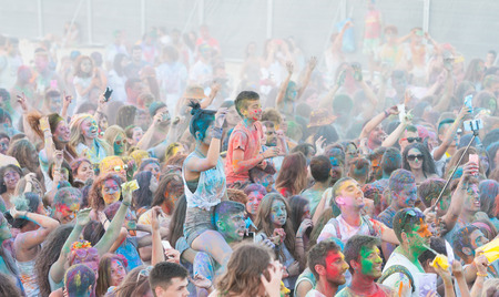 Larnaca, Cyprus - July 2015: People with coloured faces and bodies dancing and enjoying the  Colour War festival held  on July 18 2015 in  Phoinikoudes Beach  in Larnaca , Cyprusのeditorial素材