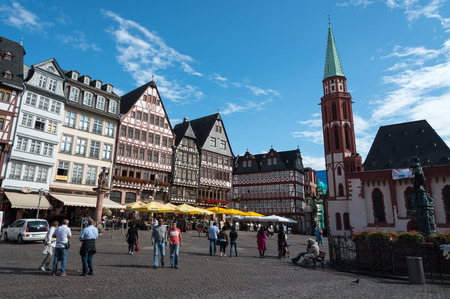 Frankfurt, Germany - September 3 2015: Tourists walking and enjoying the wonderful and colorful  buildings of the historical landmark  of  Rmerberg square  at the city of Frankfurt in Germanyのeditorial素材