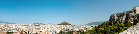 Panoramic view of the capital city of Athens in Greece with the famous Acropolis and Lykavitous hill.の写真素材