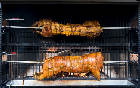 Whole roasted lambs traditionally cooked on a steel spit.  Meat foodの写真素材