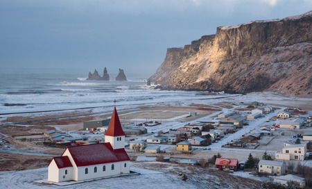 Vik Icelandic village in the Southeast Iceland covered in Snow in Spring.