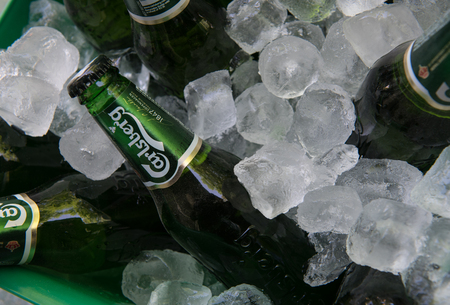 Nicosia, Cyprus - May 7 2016: Small green bottles of famous Carlsberg beer on iceのeditorial素材
