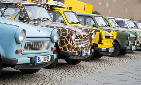 Berlin, Germany - January 19, 2016: Colourfull vintage small cars for rent by tourists to travell around Berlin, on January 19 2016 in Berlin, Germany.のeditorial素材