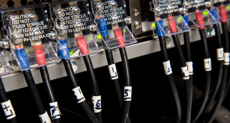 High voltage electric power cables connected to network equipment to provide electricity.
