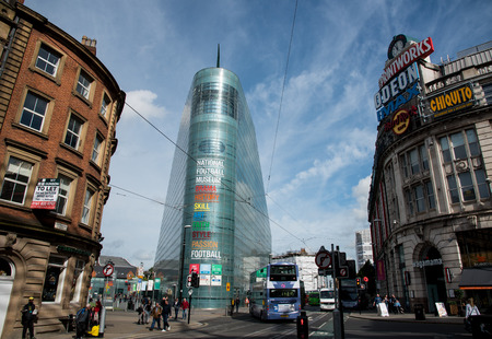 Manchester, UK - September 23, 2016: National Football museum at the Urbis building in Manchester city  in England near the exchange square with people crossing the street.のeditorial素材