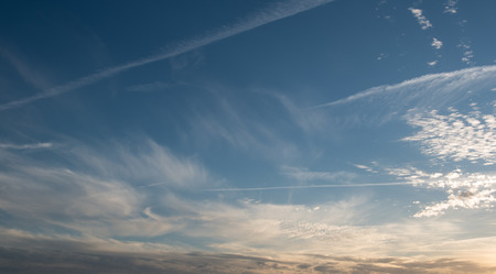 Background of a dramatic  evening  sky cloud formations just before the sunset.