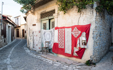 Lefkara, Cyprus - August 21 2016: Handmade lace, called lefkaritika, hanging on the wall of a house at Lefkara village, Larnaca district, Cyprusのeditorial素材