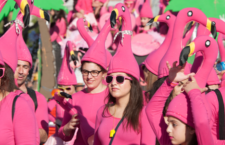 Limassol, Cyprus - February 18 2018: Happy team of people dressed in colourful costumes enjoying and parading at the famous carnival parade in Limassol city, Cyprusのeditorial素材