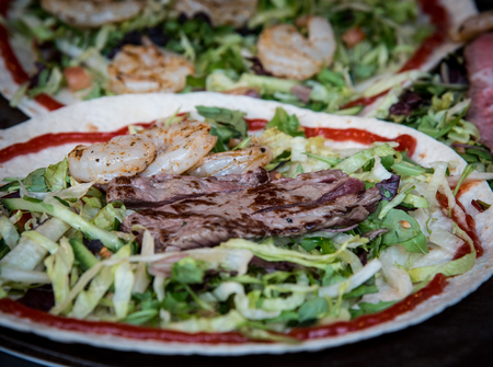 Plate with fresh healthy vegetables, meat and fish from a food marketの写真素材