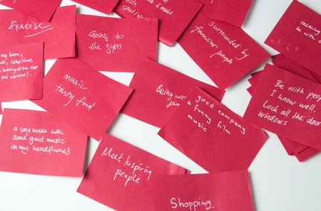 Red Sticky notes with how teenage mental health can be cure.の写真素材