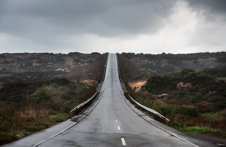 Empty asphalt highway road and stormy sky. Concept of achiving goals. の写真素材