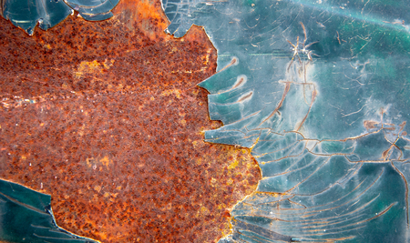 Rusty metallic surface with blue and oxidised red color creating an amazing colorful background with...
