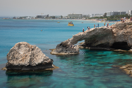 Agia Napa, , Cyprus, April  29, 2019: People standing above Sea caves on the famous lovers bridge, near Ayia Nape, Cape Greco area in Cyprusのeditorial素材
