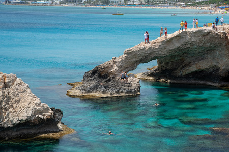 Agia Napa, , Cyprus, April  29, 2019: People standing above Sea caves on the famous lovers bridge, near Ayia Nape, Cape Greco area in Cyprusのeditorial素材
